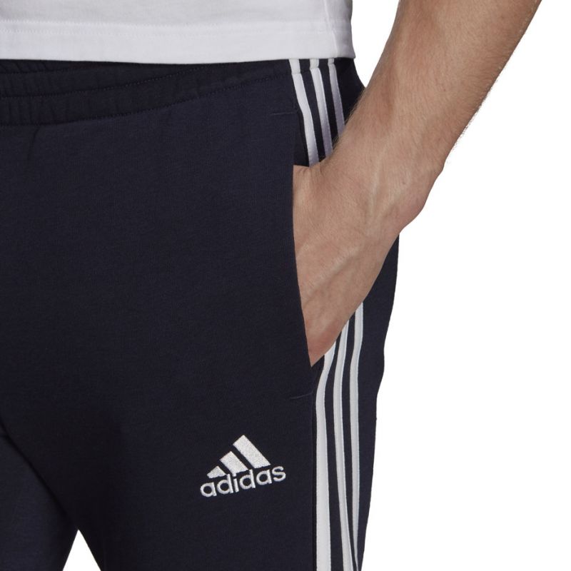 Tepláky adidas Essentials Tapered Cuff 3 Stripes M GK8977