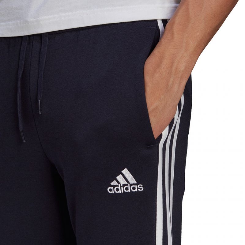 Tepláky adidas Essentials Fleece Tapered Cuff 3-Band M GK8823