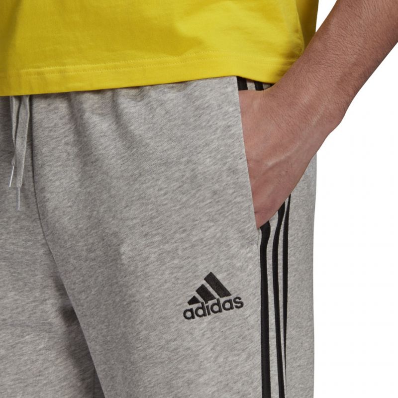 Tepláky adidas Essentials Tapered Cuff 3 Stripes M GK8889